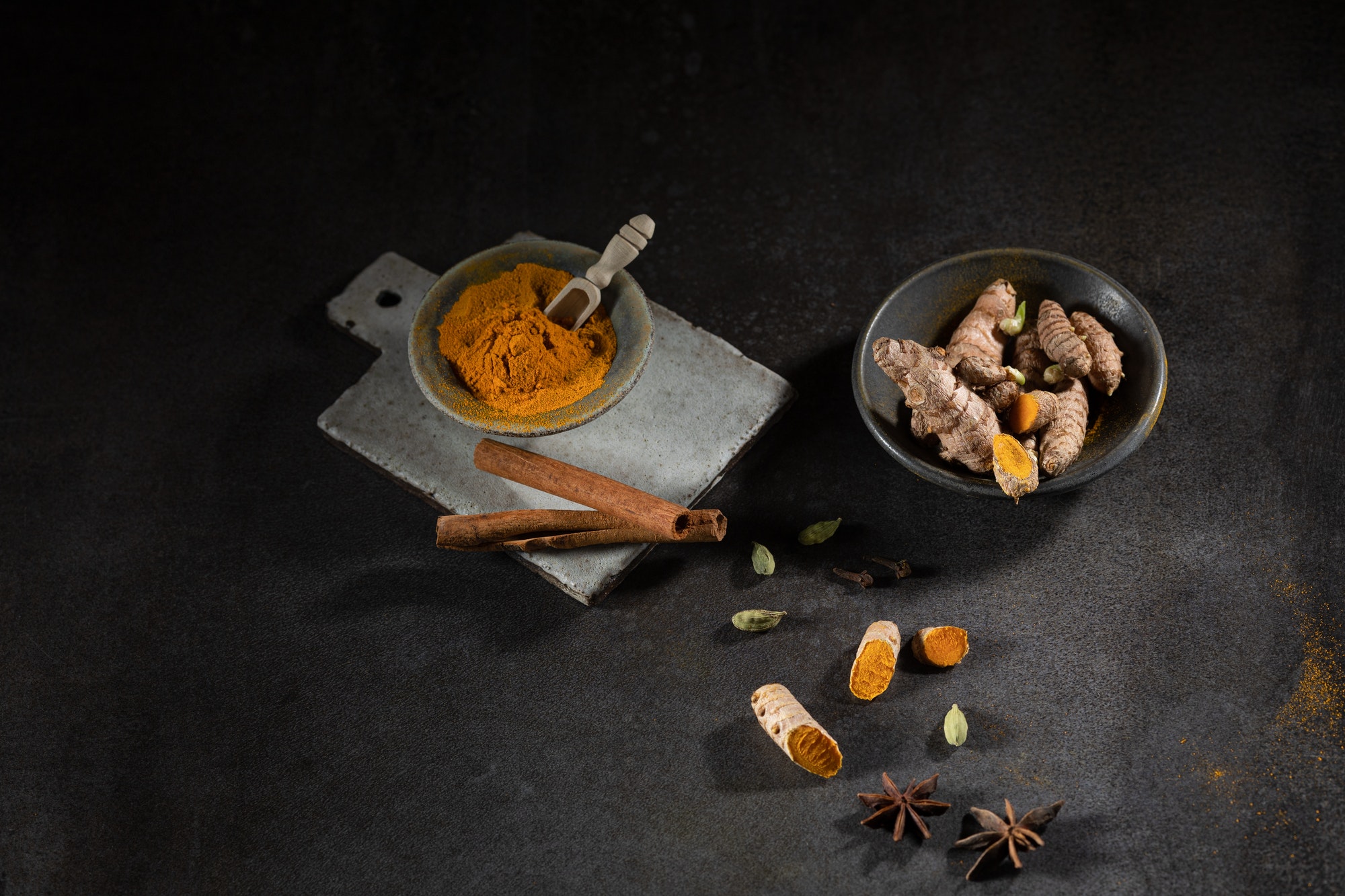 Spices Ayurveda turmeric cinnamon anise on a dark background